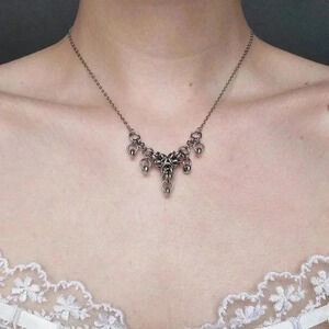 Gothic silver V shaped crown necklace with a small silver chain
